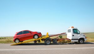 Factors influencing towing costs during emergency roadside assistance in rural areas with vehicles on flatbeds