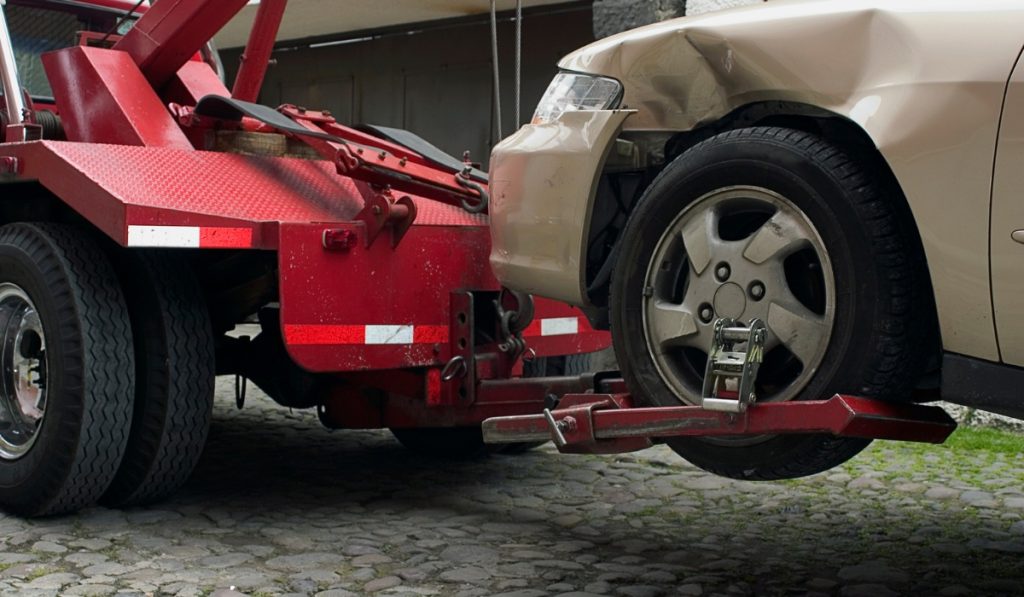 Tow truck transporting a vehicle for long distance towing